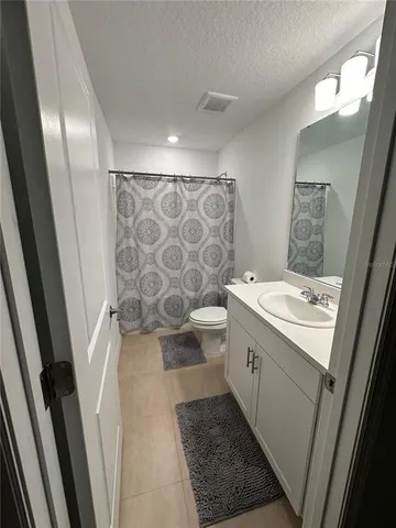 a view of a patio with couches table and chairs