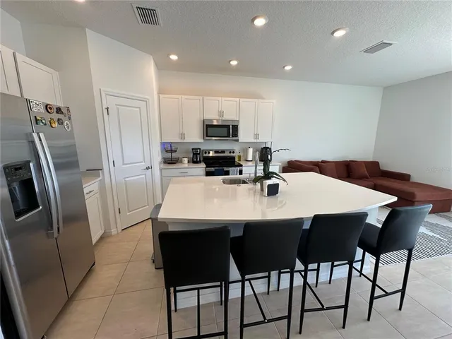 a bed room with a bed and a large window