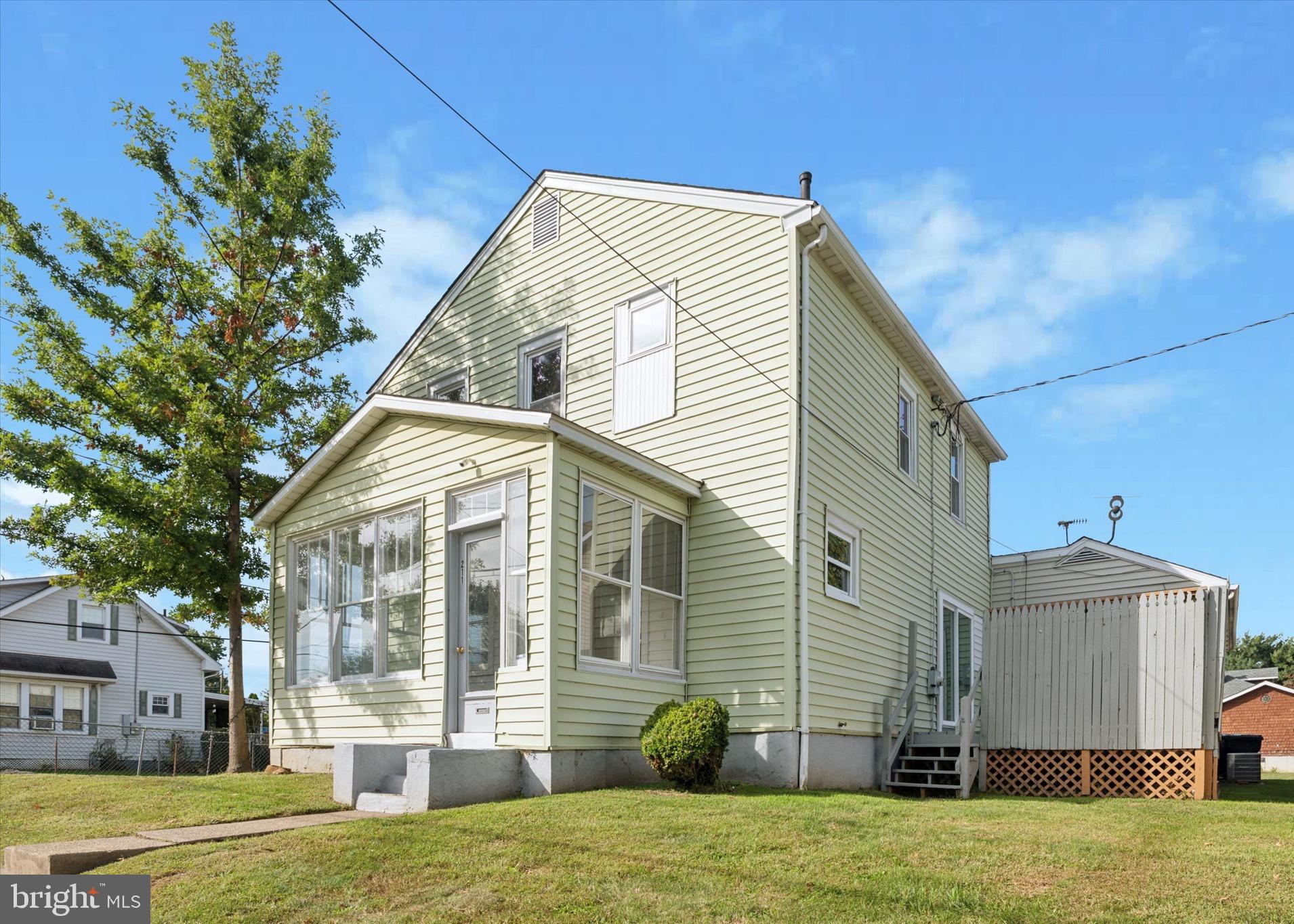 a view of a house with a yard