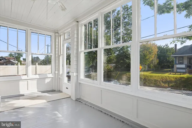 a view of a glass door with a yard