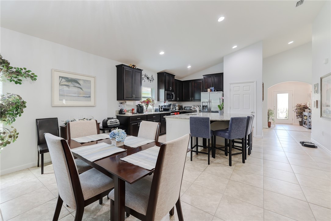 5997 Ridge Lake Circle Vero Beach, FL 32967 - Photo 12 of 36 a view of a dining room with furniture