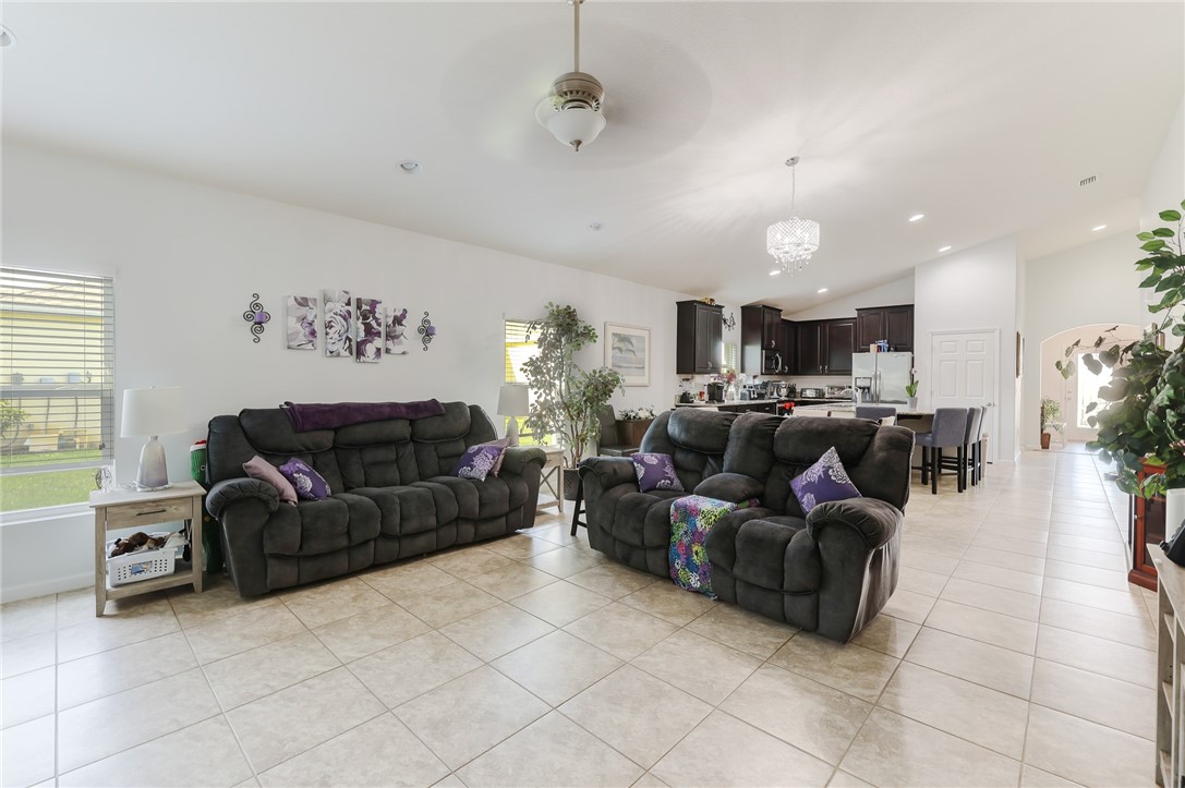 5997 Ridge Lake Circle Vero Beach, FL 32967 - Photo 14 of 36 a living room with furniture and a window