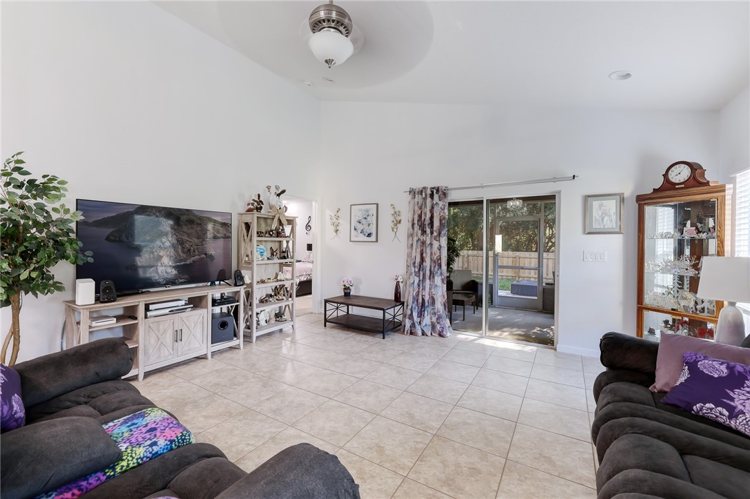 5997 Ridge Lake Circle Vero Beach, FL 32967 - Photo 16 of 36 a living room with furniture and a flat screen tv