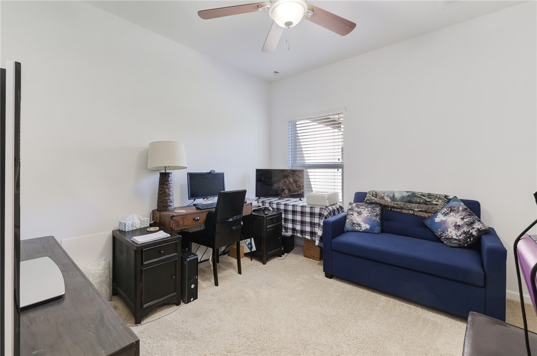 5997 Ridge Lake Circle Vero Beach, FL 32967 - Photo 22 of 36 a living room with furniture and a piano