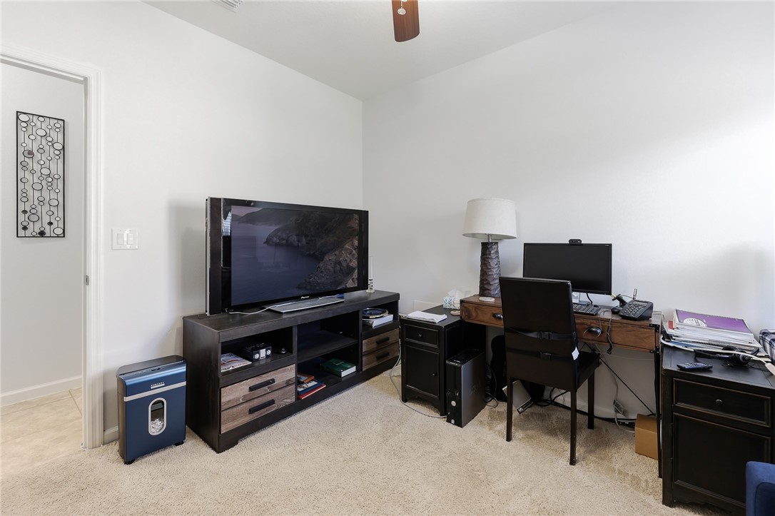 5997 Ridge Lake Circle Vero Beach, FL 32967 - Photo 23 of 36 a living room with furniture and a flat screen tv