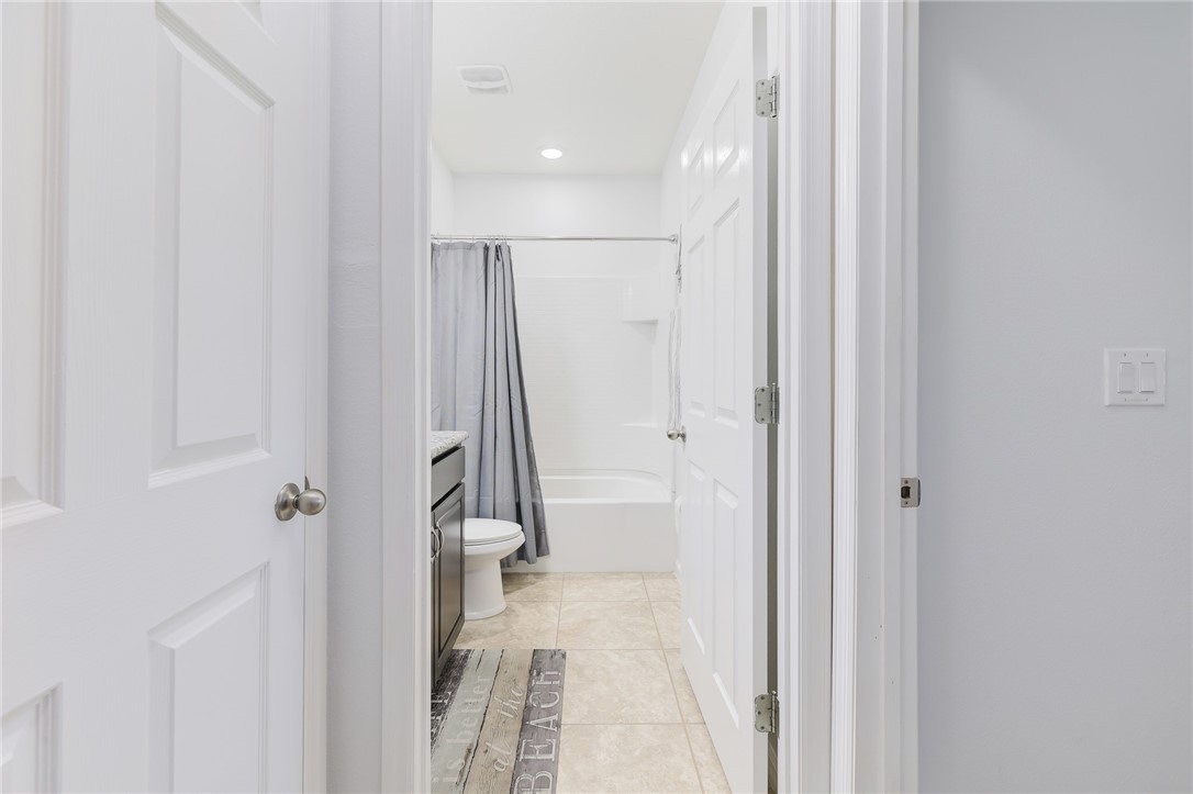 5997 Ridge Lake Circle Vero Beach, FL 32967 - Photo 27 of 36 a bathroom with a shower and a glass door