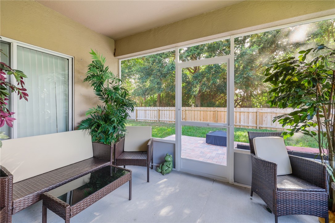 5997 Ridge Lake Circle Vero Beach, FL 32967 - Photo 30 of 36 a balcony with furniture and garden view