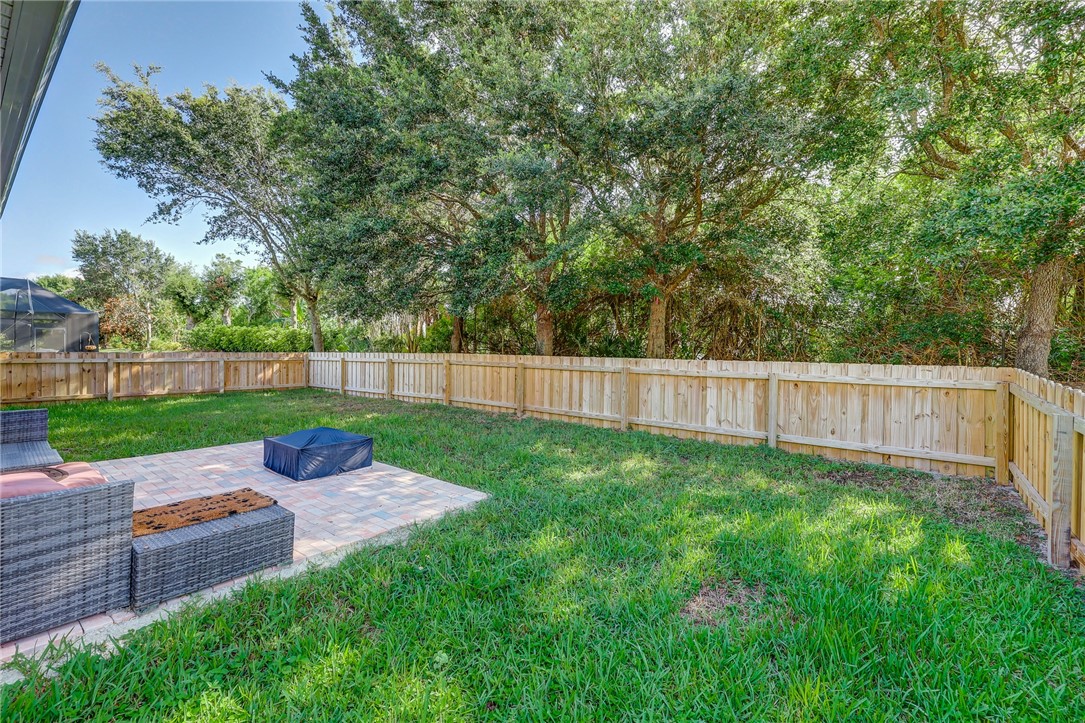 5997 Ridge Lake Circle Vero Beach, FL 32967 - Photo 32 of 36 a view of a backyard with a garden