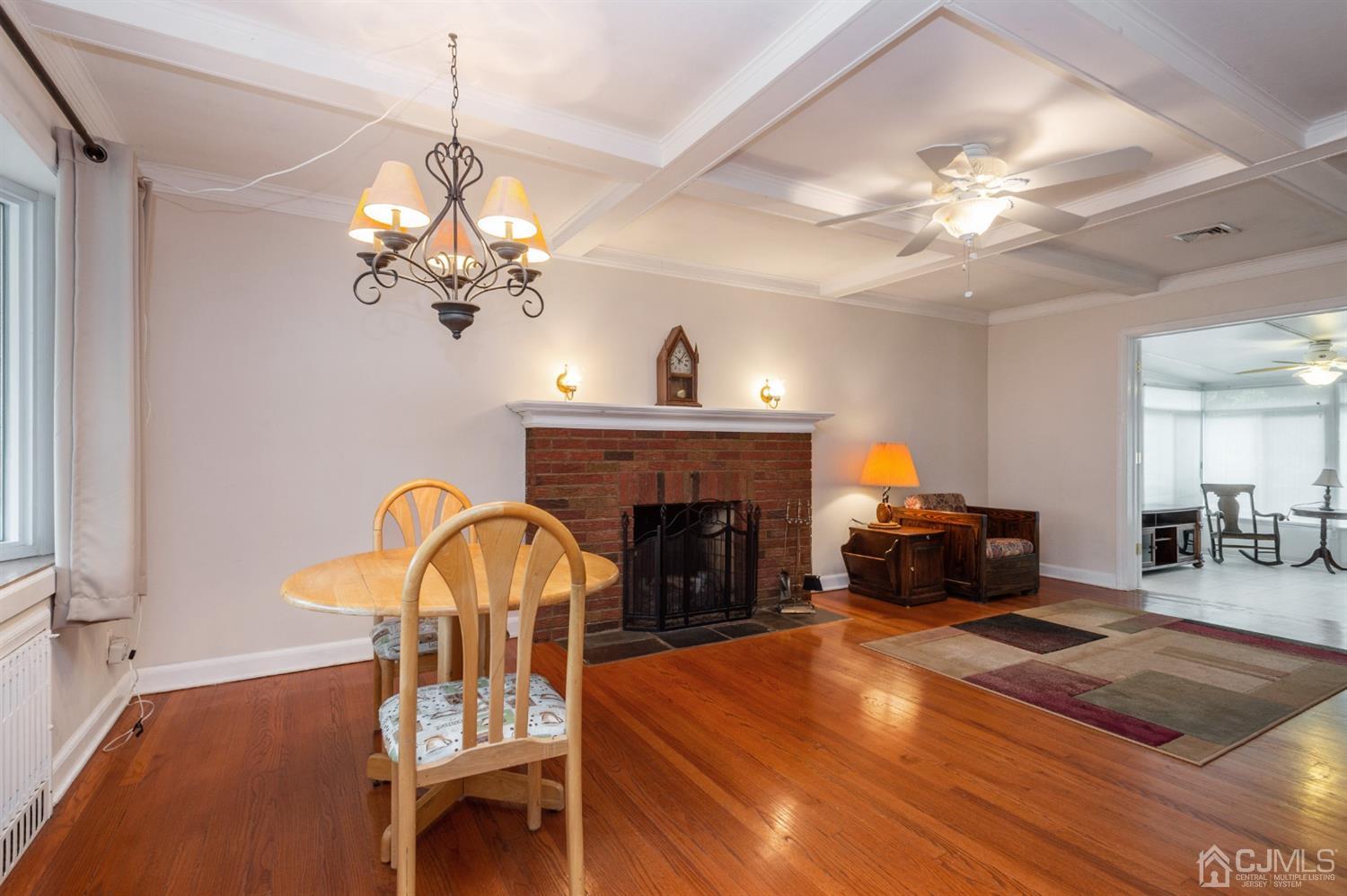 38 Greenbrook Road Middlesex, NJ 08846 - Photo 5 of 18 a living room with furniture and a chandelier