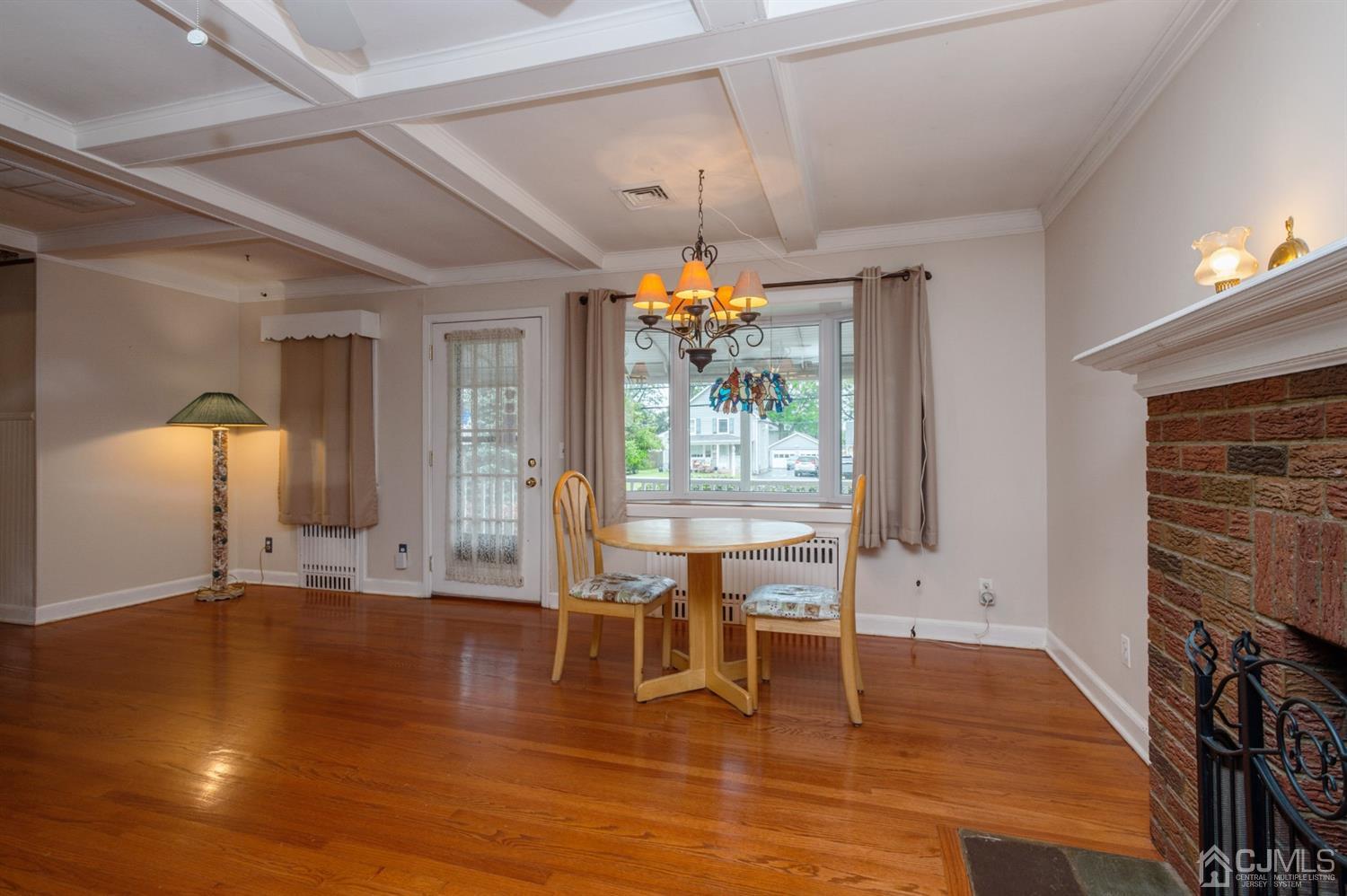 38 Greenbrook Road Middlesex, NJ 08846 - Photo 6 of 18 a living room with fireplace furniture and a wooden floor