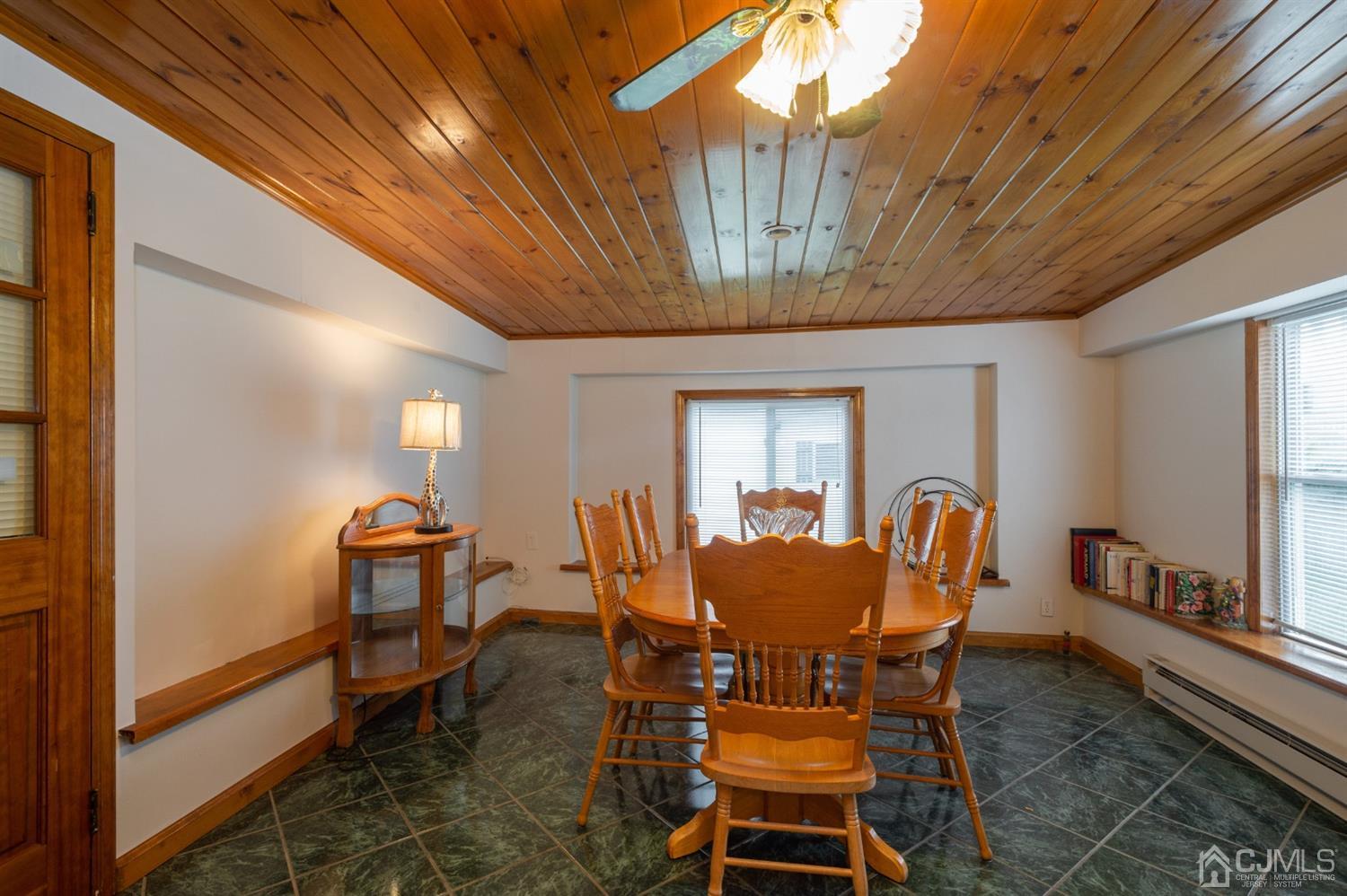 38 Greenbrook Road Middlesex, NJ 08846 - Photo 10 of 18 a view of a dining room with furniture window and wooden floor