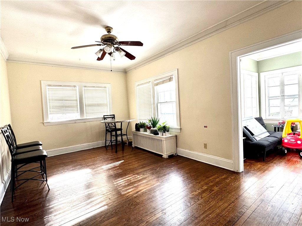 2152 Middlefield Road Cleveland, OH 44106 - Photo 26 of 50 Sitting room with crown molding, radiator, and dark wood-type flooring