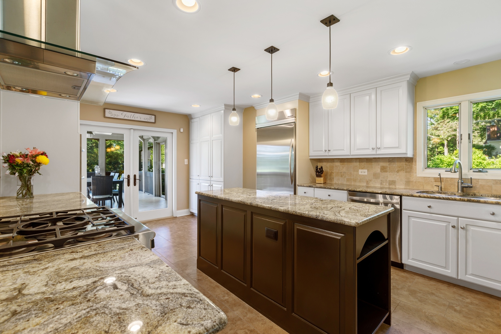 800 Sterling Road Inverness, IL 60067 - Photo 2 of 43 a kitchen with a stove a sink a refrigerator and a window