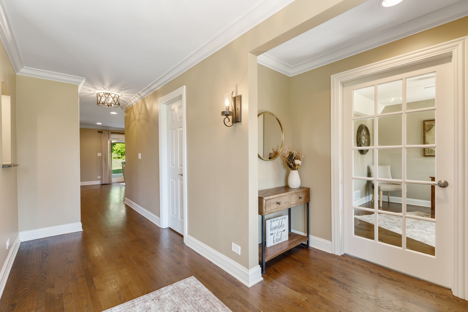 800 Sterling Road Inverness, IL 60067 - Photo 8 of 43 a view of a hallway with wooden floor and windows