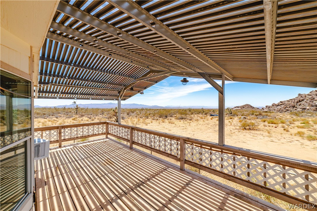 16435 South Wyatt Earp Road Yucca, AZ 86438 - Photo 17 of 57 Expansive outdoor deck featuring wood flooring and a patterned wood railing