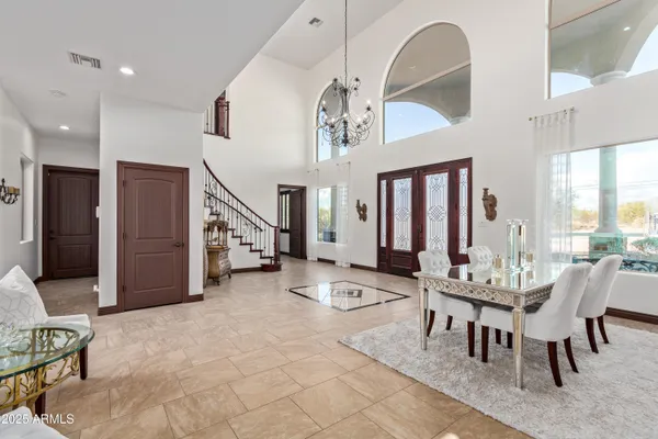 a view of entryway and hall with a view of living room