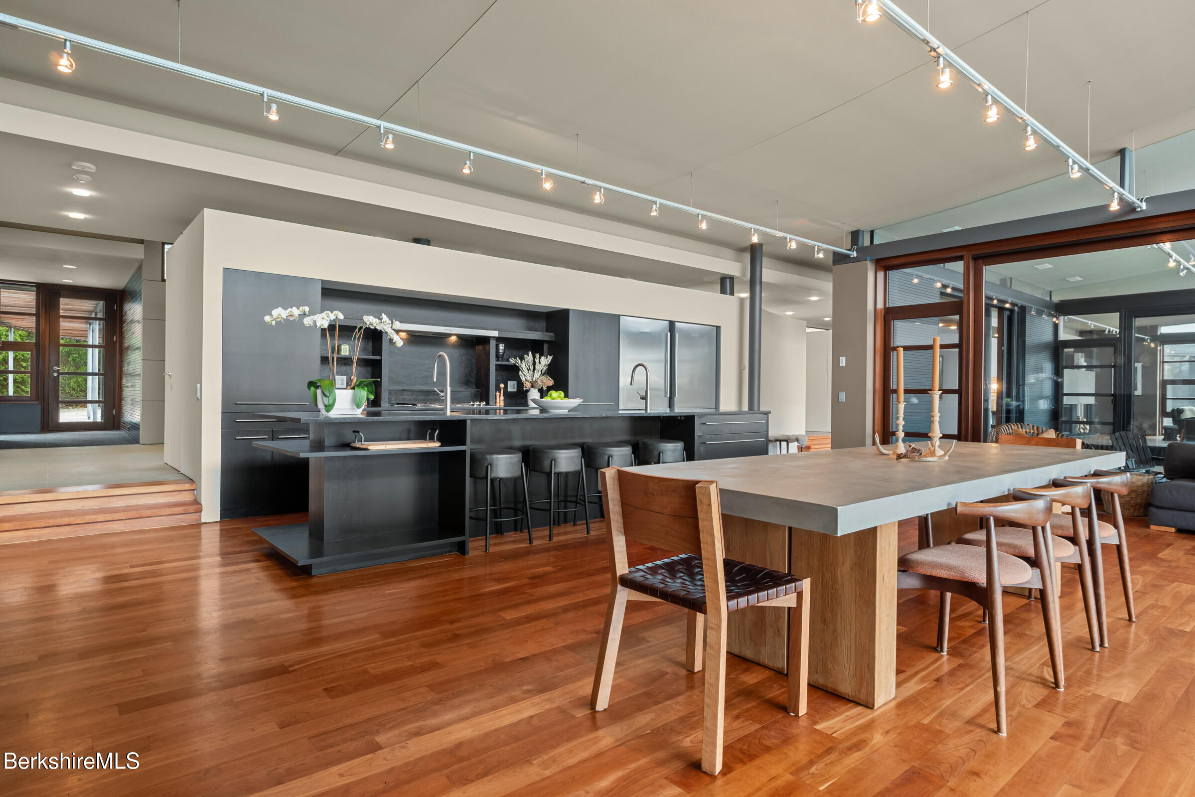250 Long Pond Road Great Barrington, MA 01230 - Photo 5 of 56 a view of a dining room with furniture and wooden floor