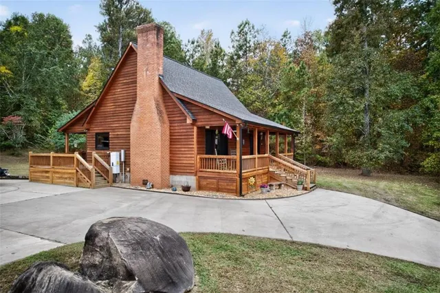 an aerial view of a houses with outdoor space