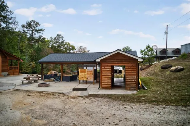 a bedroom with furniture and a large window