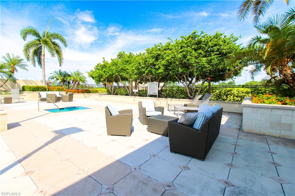 9123 Strada Place, Unit 7410 Naples, FL 34108 - Photo 6 of 50 View of patio with an outdoor hangout area