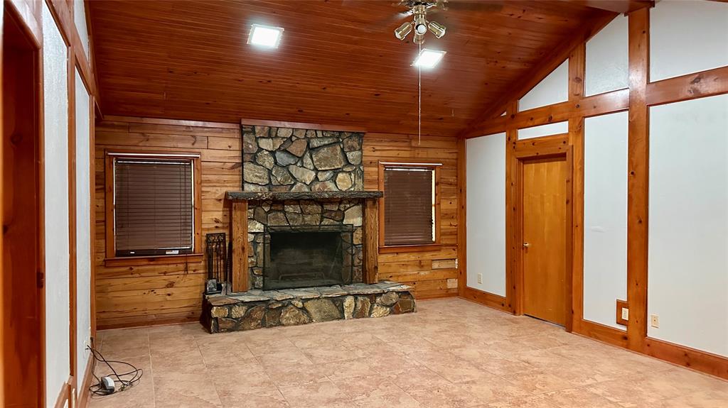 126 Garza Road Shady Shores, TX 76208 - Photo 3 of 19 an empty room with a fireplace and window