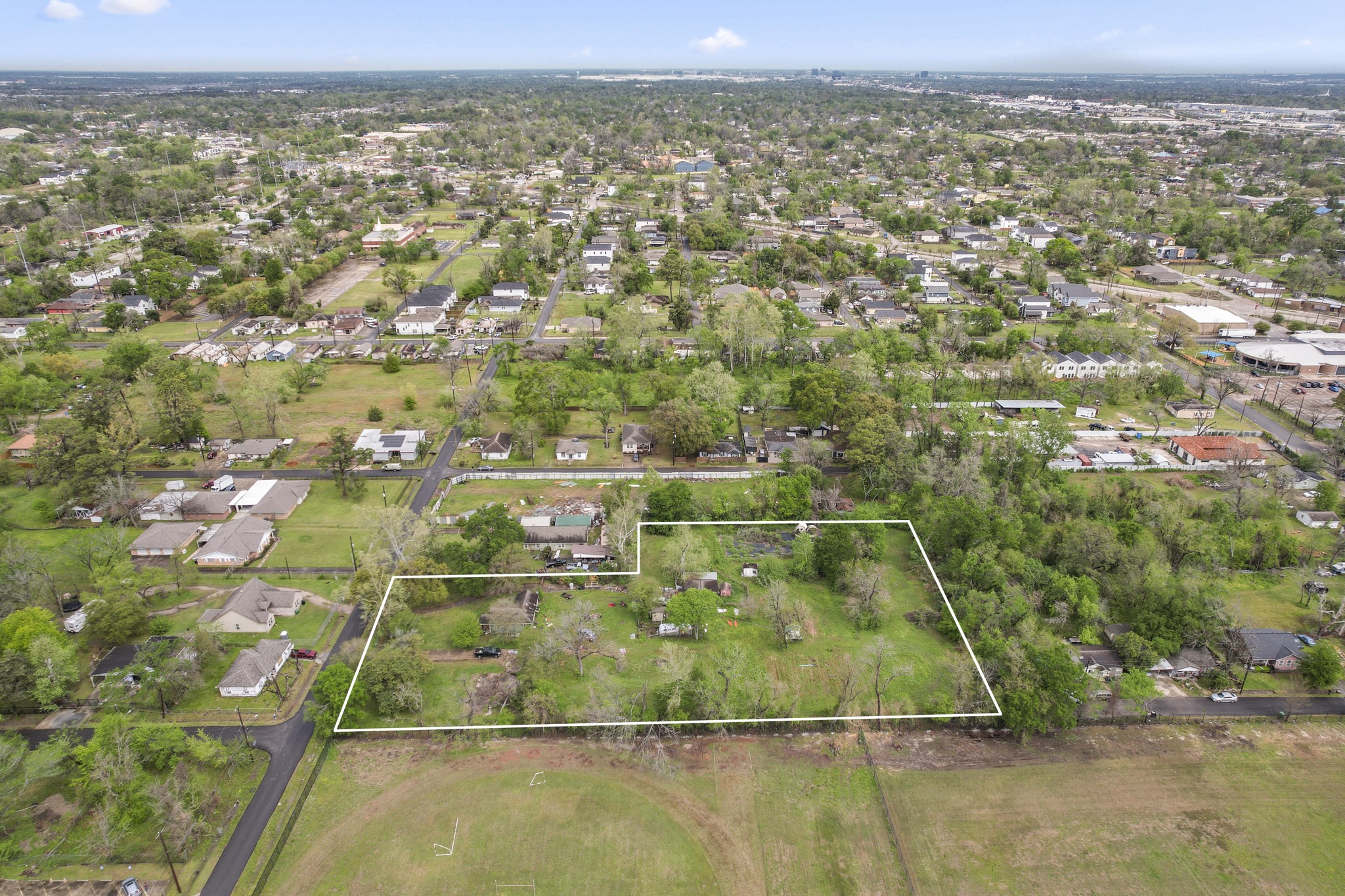 6302 Tuskegee Street Houston, TX 77091 - Photo 12 of 27 an aerial view of residential houses with outdoor space and trees