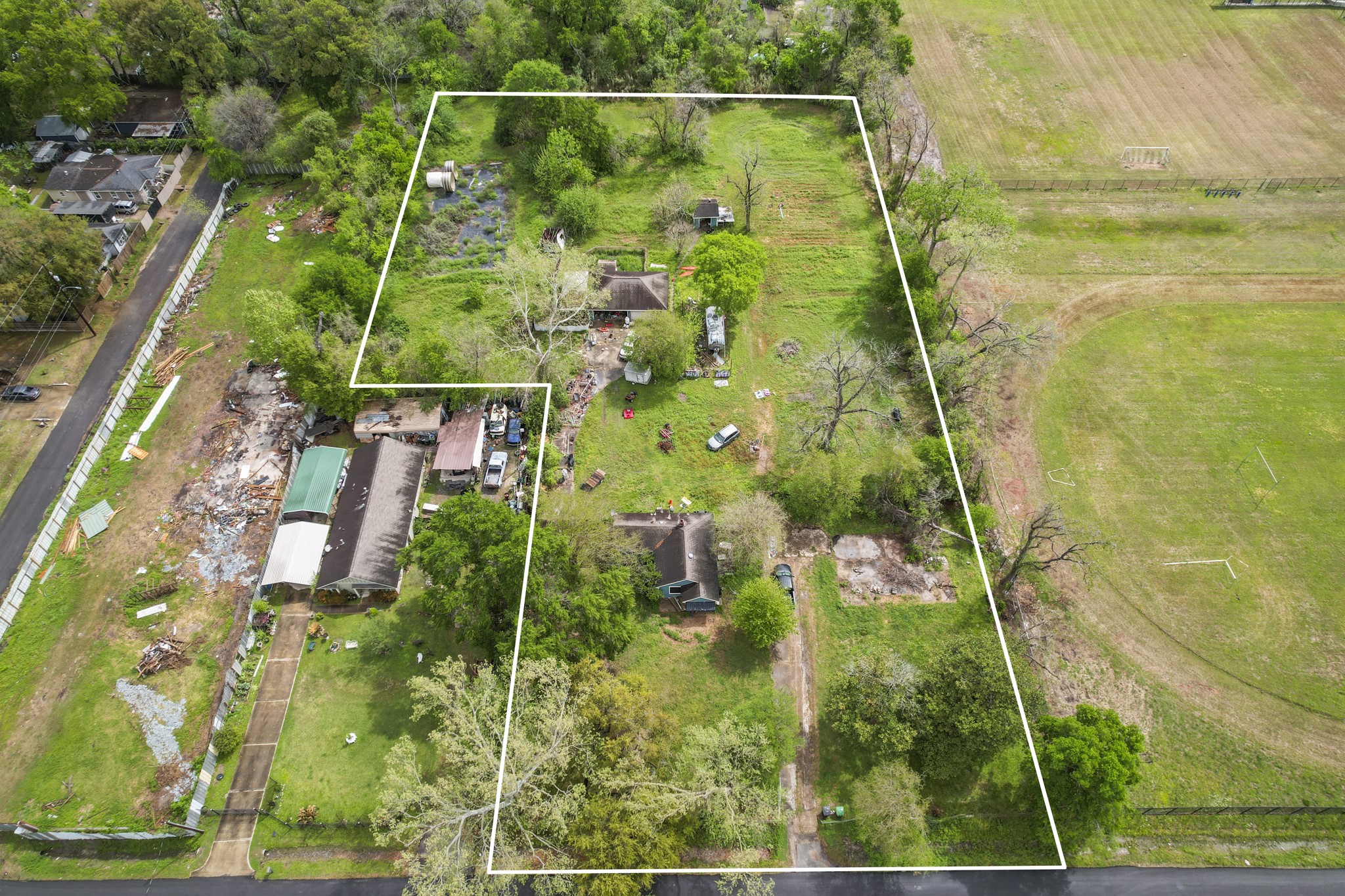 6302 Tuskegee Street Houston, TX 77091 - Photo 15 of 27 a aerial view of residential houses with yard