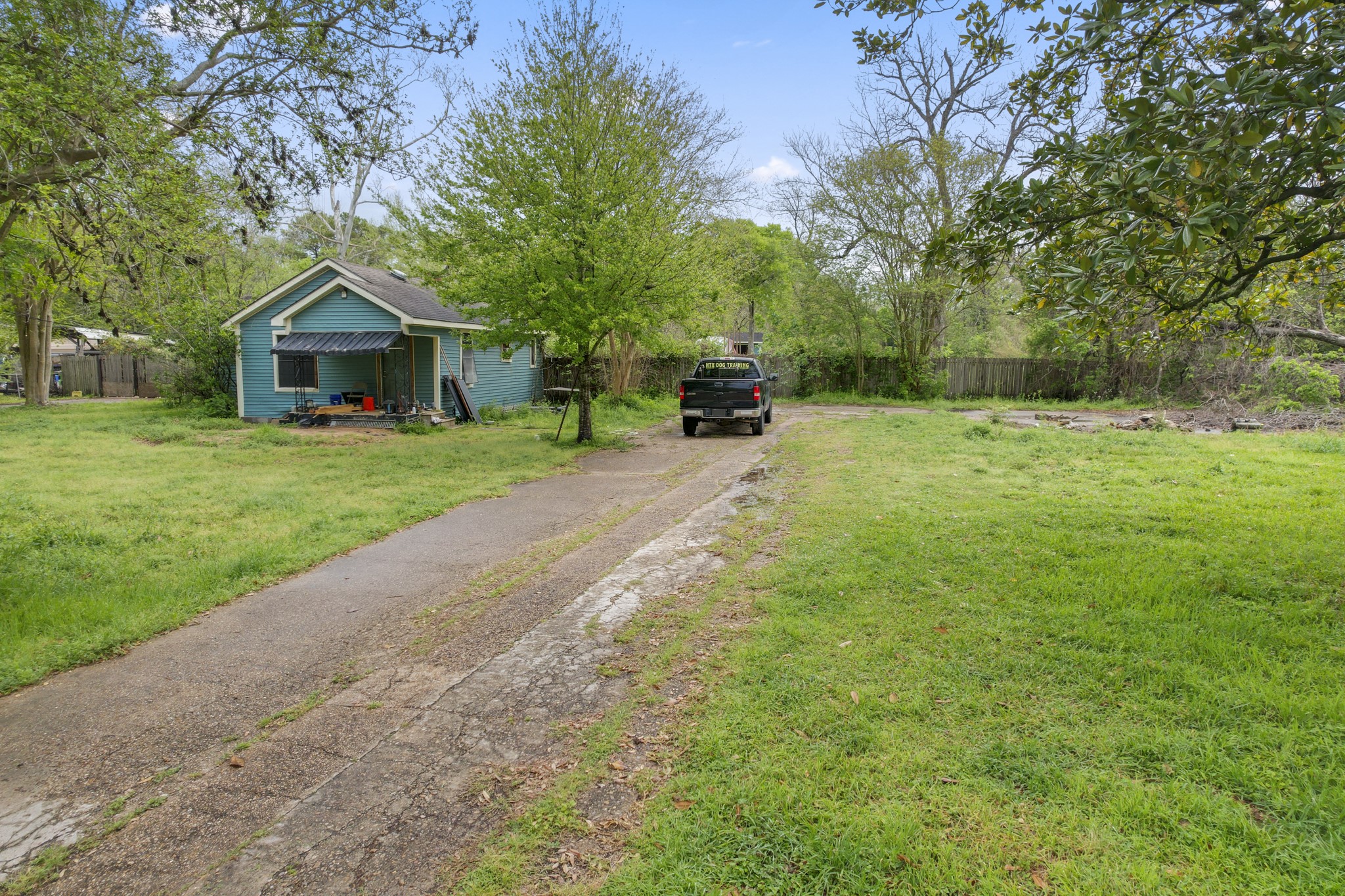 6302 Tuskegee Street Houston, TX 77091 - Photo 17 of 27 a small house with a tree in the grass
