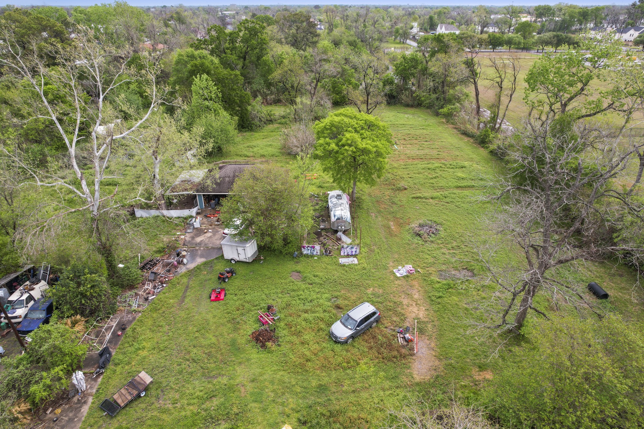 6302 Tuskegee Street Houston, TX 77091 - Photo 18 of 27 a view of a garden with plants and large trees