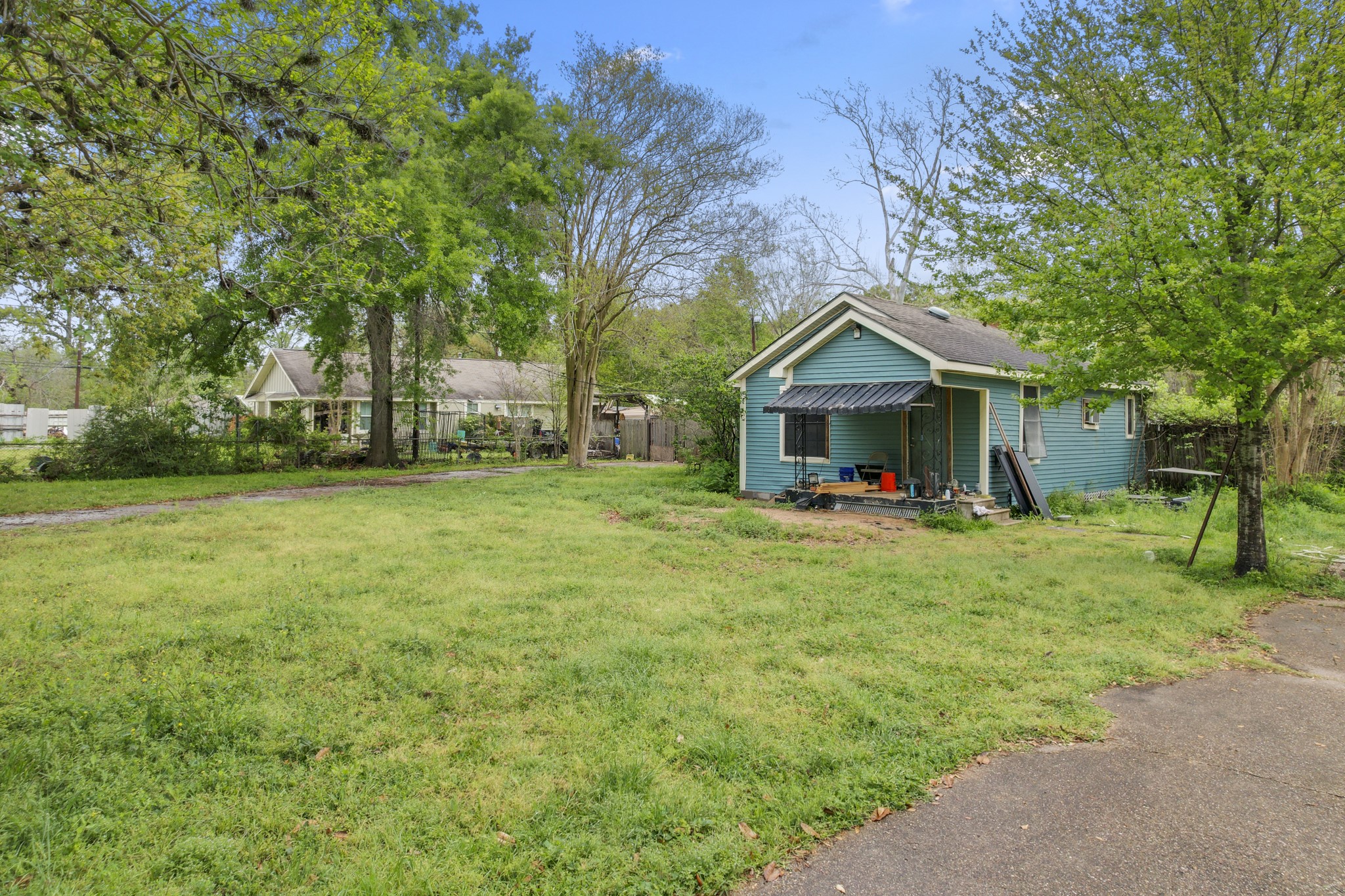 6302 Tuskegee Street Houston, TX 77091 - Photo 24 of 27 a view of a house with backyard and tree