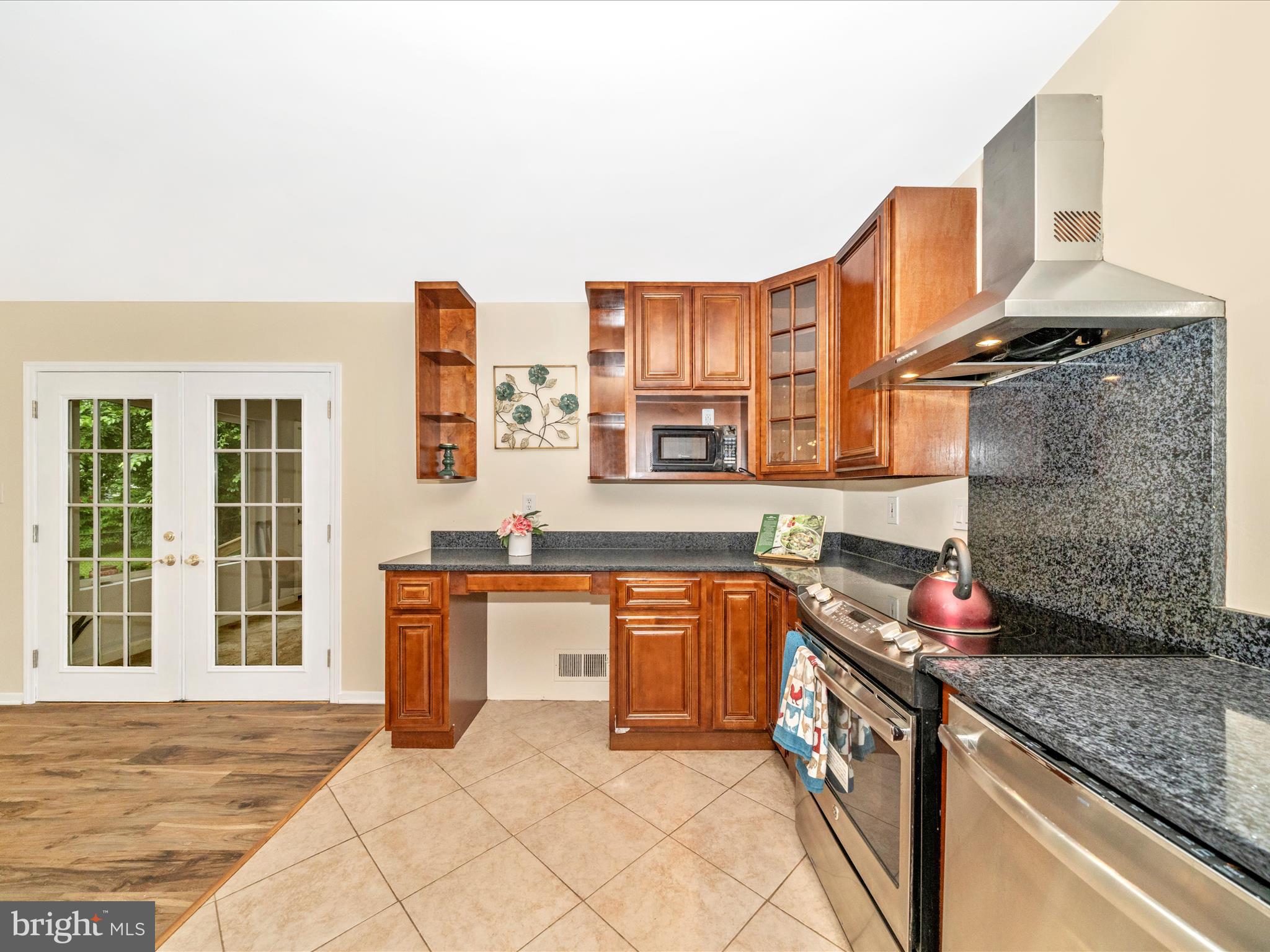 3313 Estelle Terrace Silver Spring, MD 20906 - Photo 17 of 52 a kitchen with stainless steel appliances granite countertop a sink stove and granite counter tops