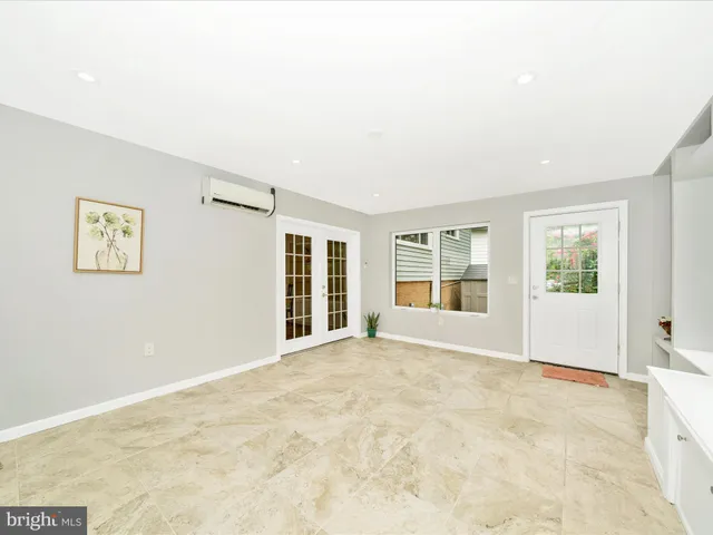 a view of an empty room with a window