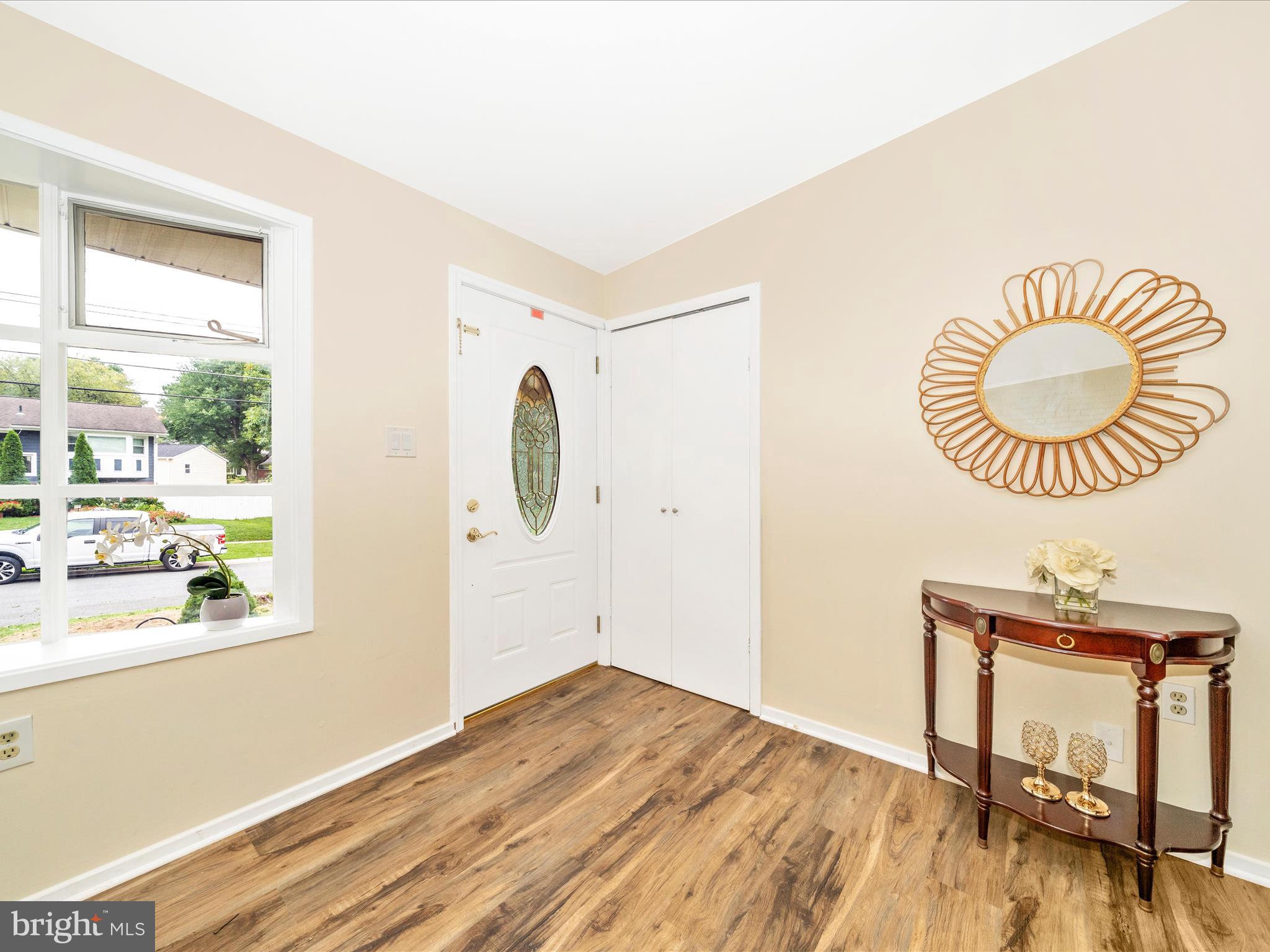 3313 Estelle Terrace Silver Spring, MD 20906 - Photo 3 of 52 a view of a room with wooden floor and white walls