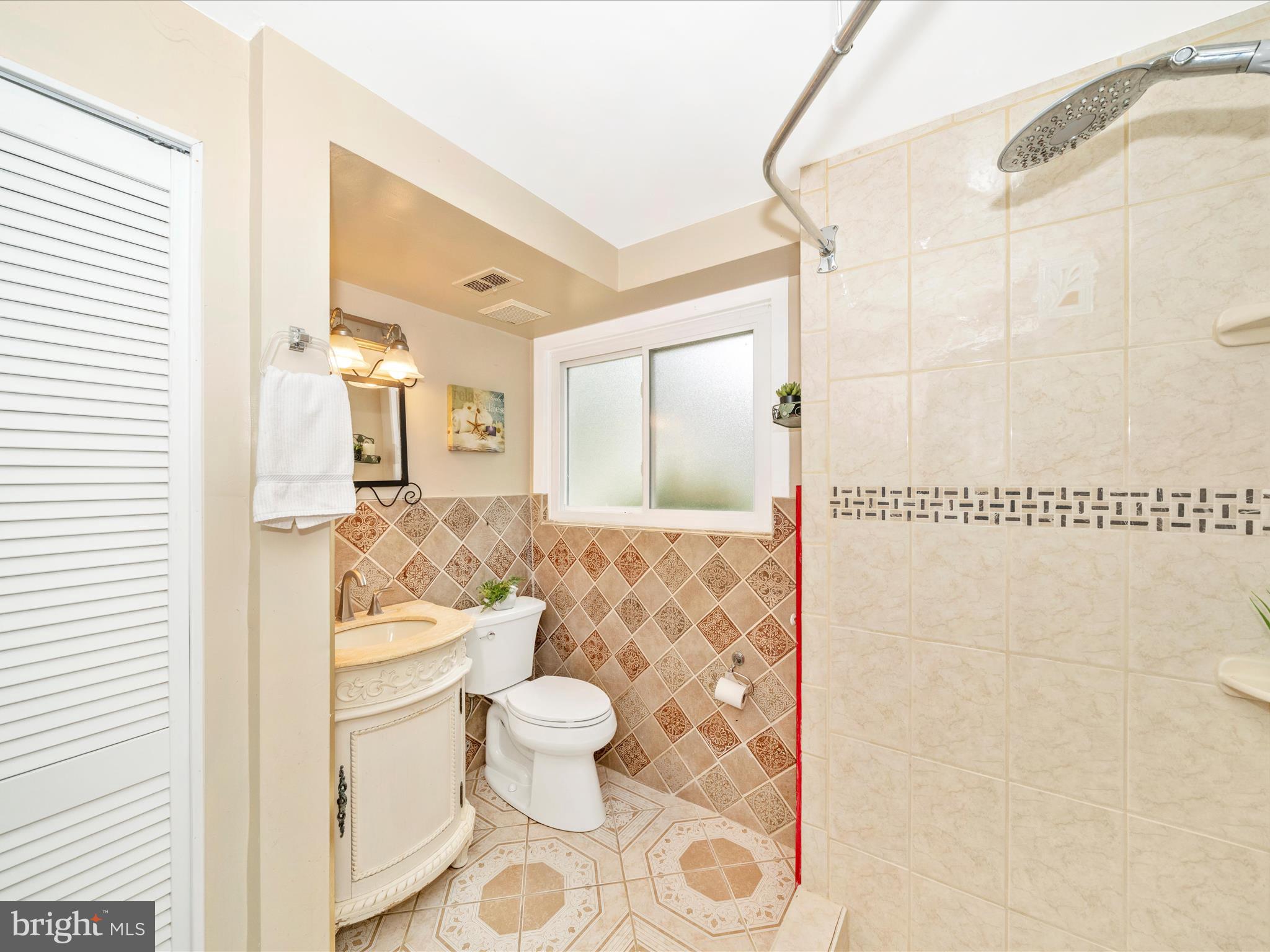 3313 Estelle Terrace Silver Spring, MD 20906 - Photo 39 of 52 a bathroom with a toilet sink and shower