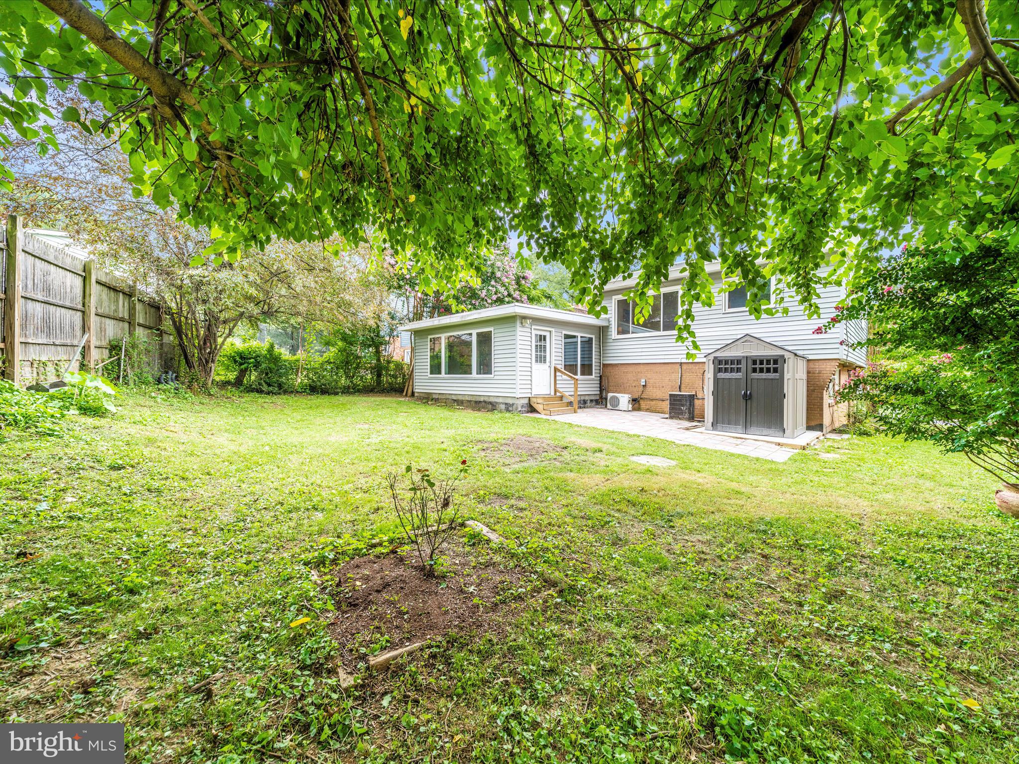 3313 Estelle Terrace Silver Spring, MD 20906 - Photo 45 of 52 a view of a house with a yard and sitting area