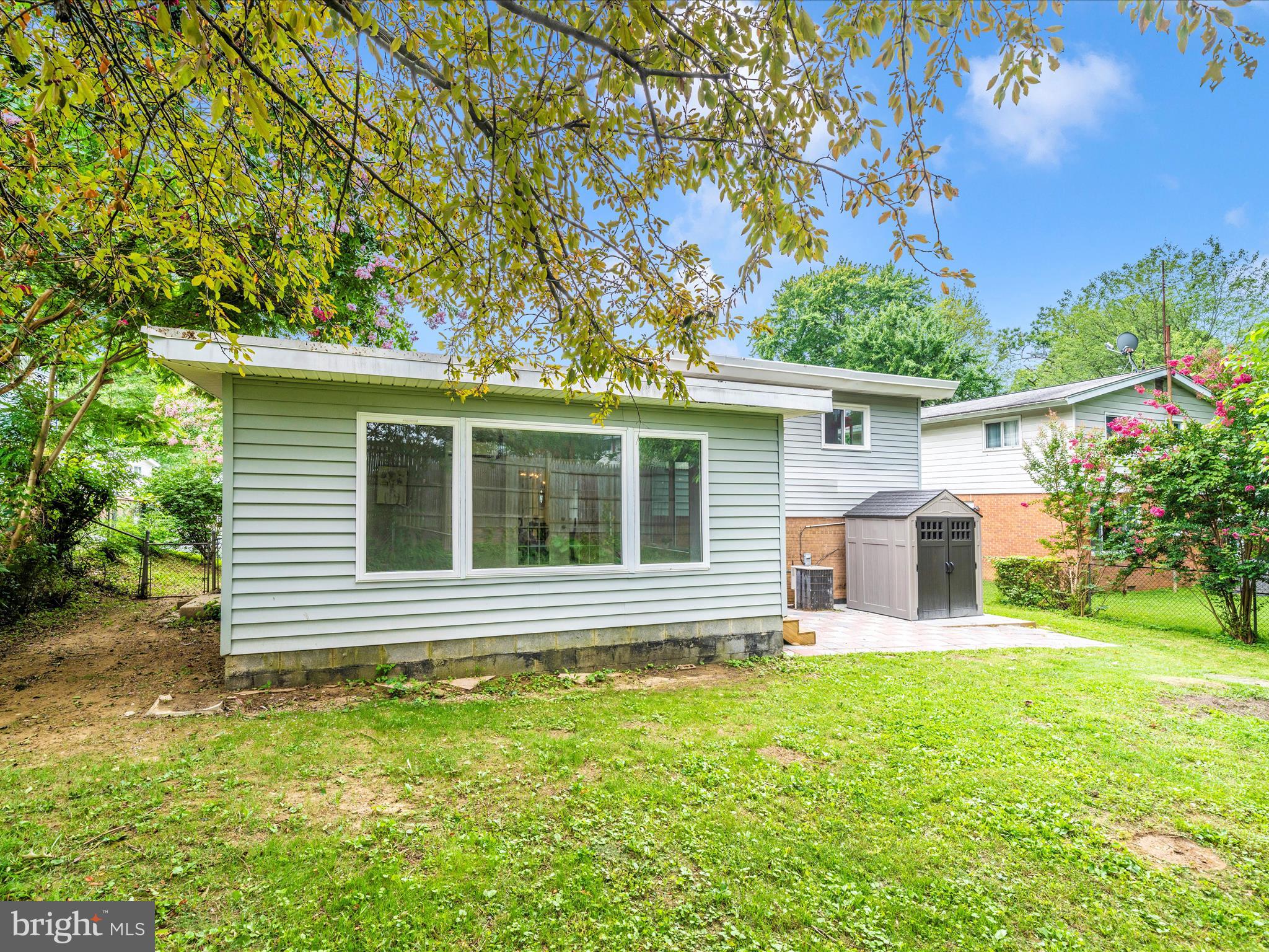 3313 Estelle Terrace Silver Spring, MD 20906 - Photo 48 of 52 a view of a house with backyard and a tree