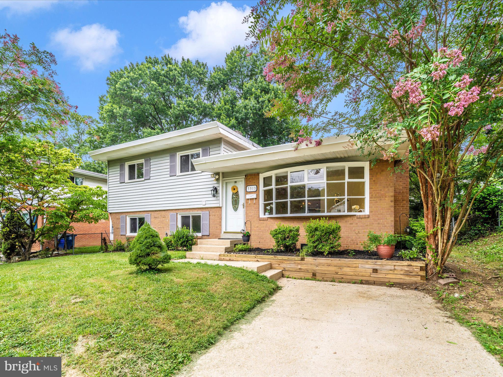 3313 Estelle Terrace Silver Spring, MD 20906 - Photo 50 of 52 a front view of a house with a yard and porch