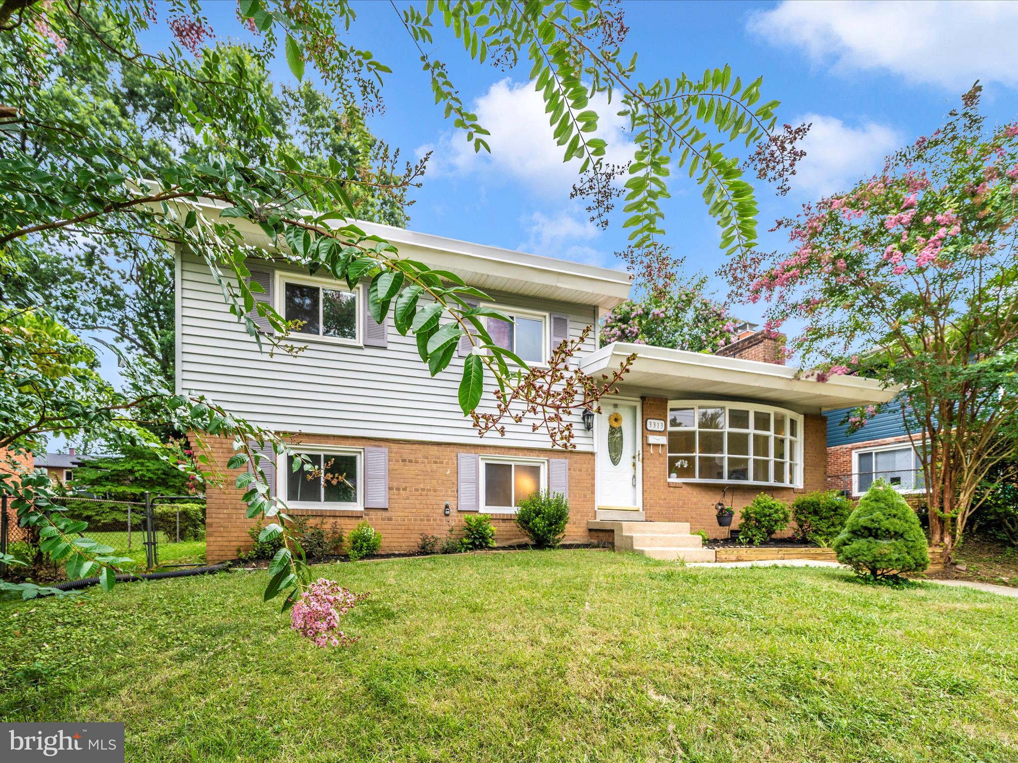 3313 Estelle Terrace Silver Spring, MD 20906 - Photo 51 of 52 a front view of a house with a yard