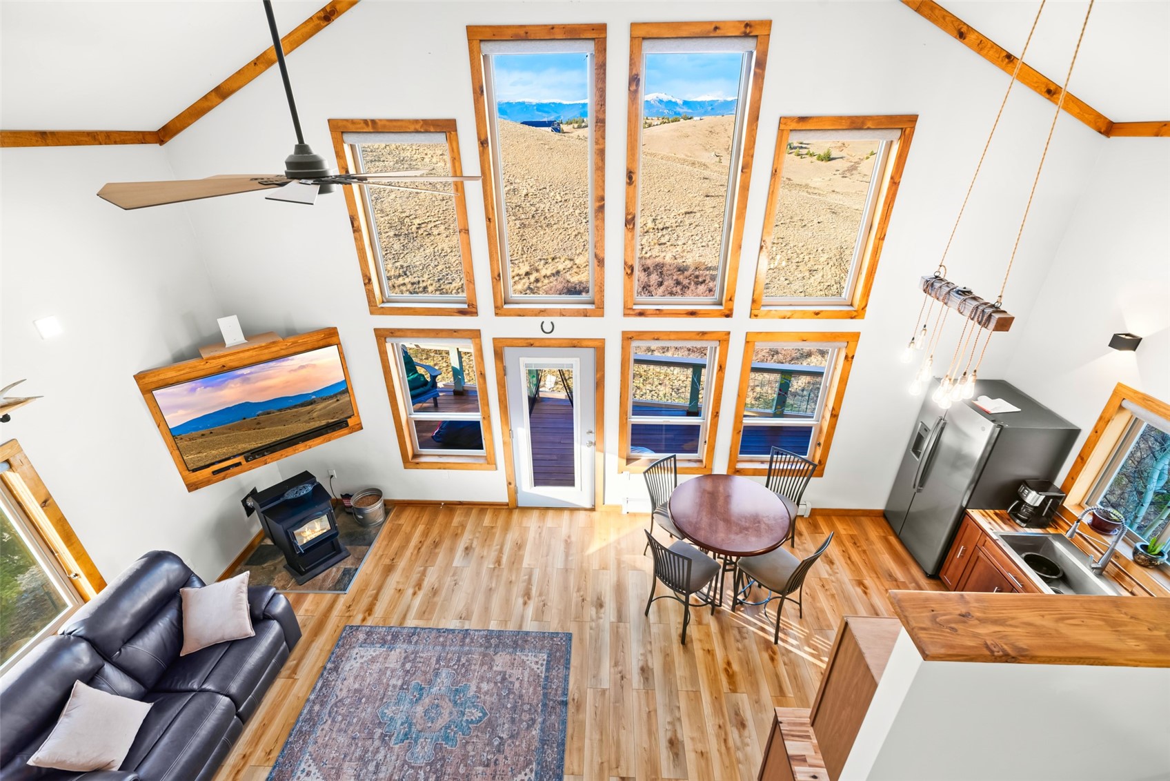 440 Arland Road Como, CO 80432 - Photo 18 of 49 a living room with furniture and a floor to ceiling window
