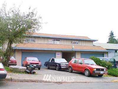 a front view of a house with parking space