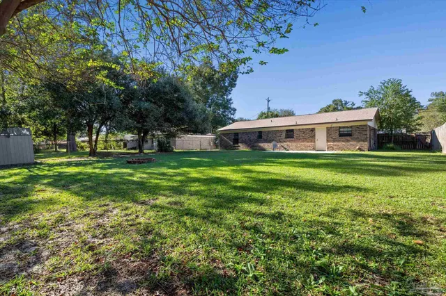 a view of a house with a big yard