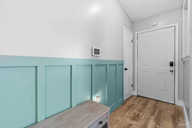 a bedroom with a sink and a mirror