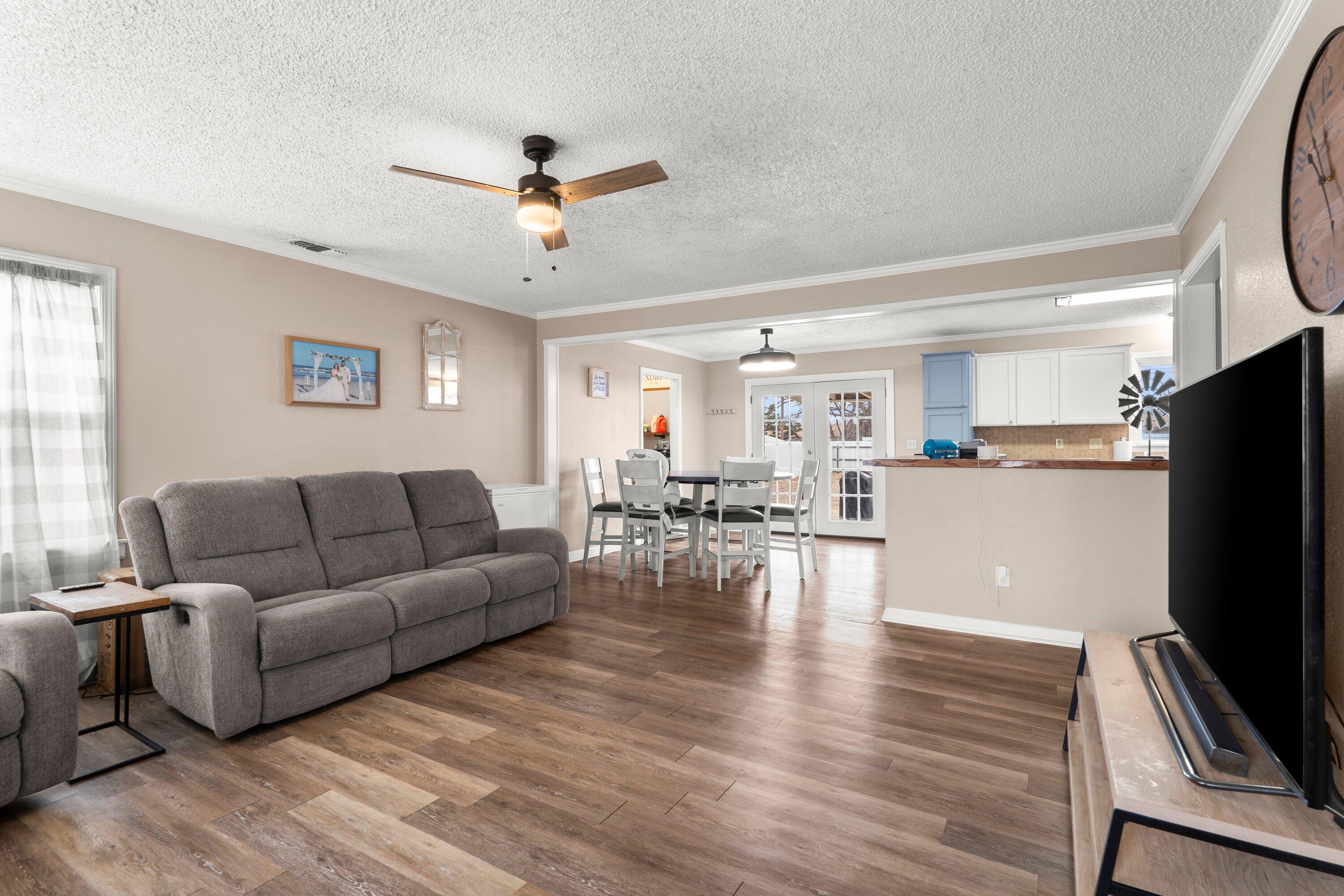 505 East 15th Street Littlefield, TX 79339 - Photo 5 of 22 a living room with furniture flat screen tv and a window