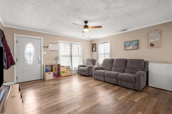 a living room with furniture and a window