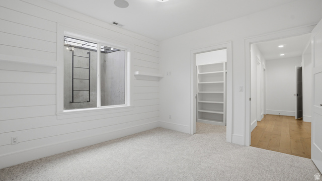 1682 North 1950 W Street, Unit 9 Provo, UT 84604 - Photo 51 of 84 Room featuring light-colored carpeting and shiplap wall finishes