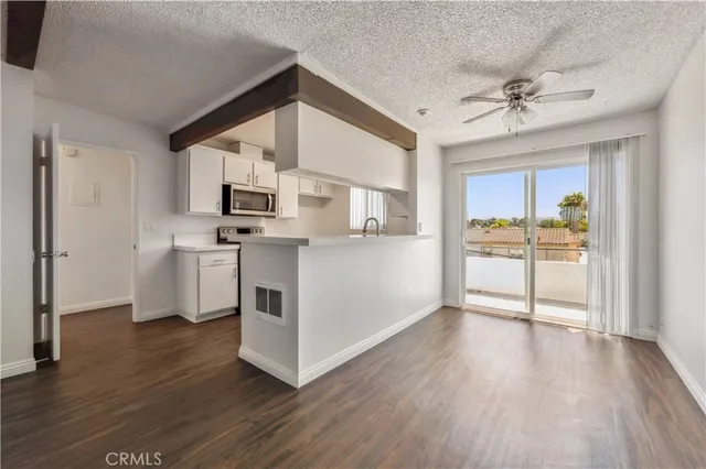 a kitchen with stainless steel appliances granite countertop a stove and a sink