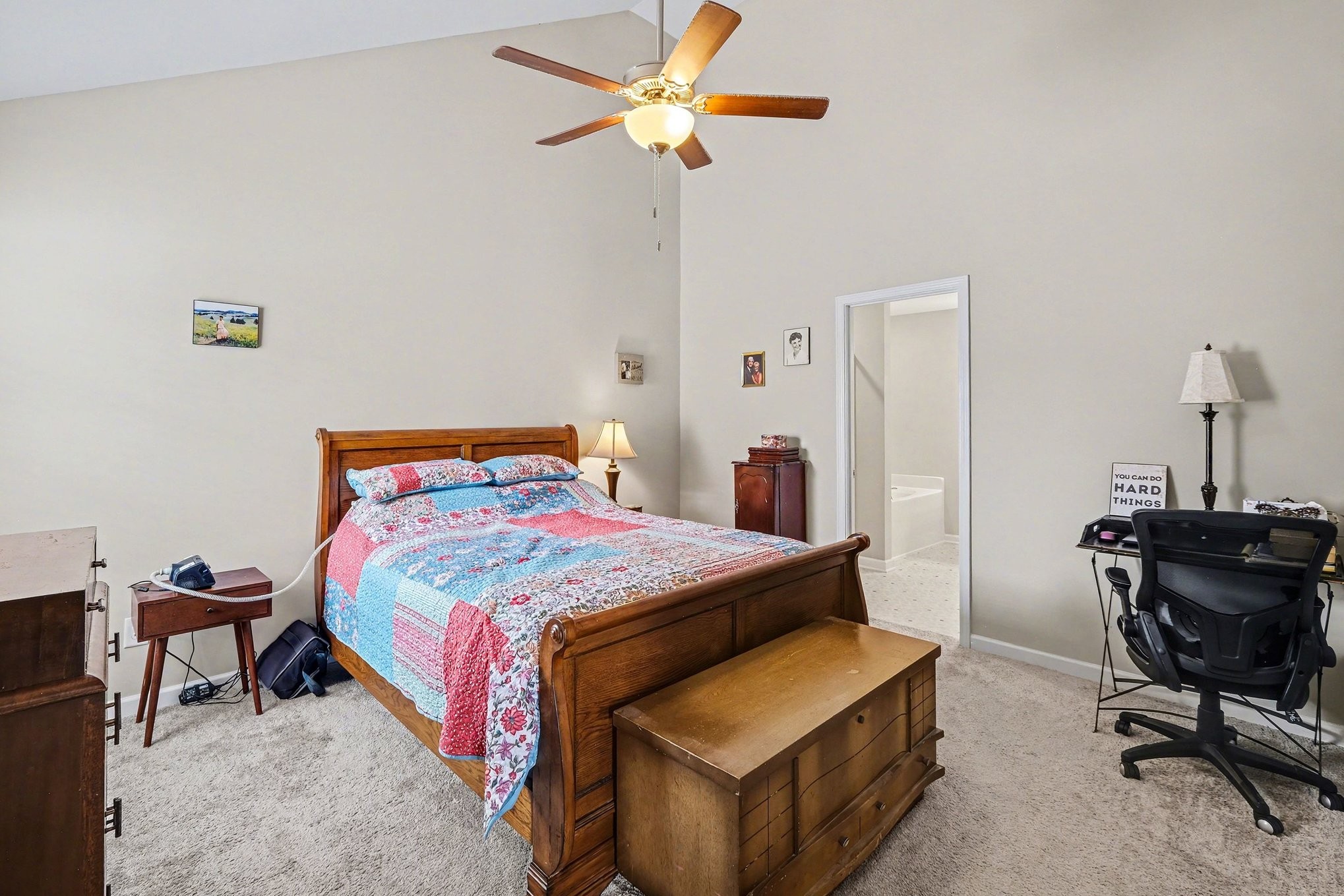 381 Ezra Street Pleasant View, TN 37146 - Photo 18 of 31 a bedroom with a bed and a chandelier