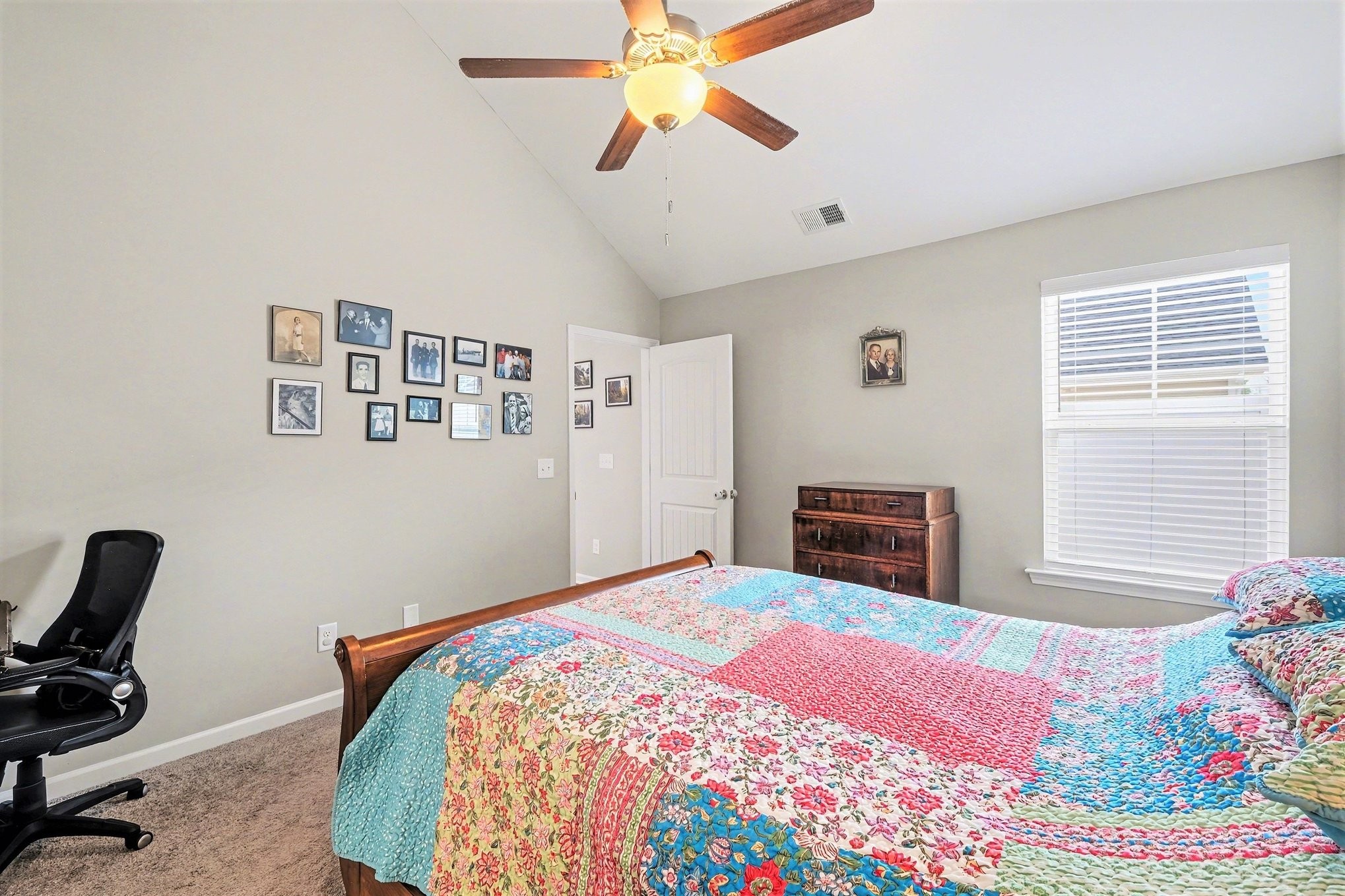 381 Ezra Street Pleasant View, TN 37146 - Photo 20 of 31 a bedroom with a bed and a chandelier