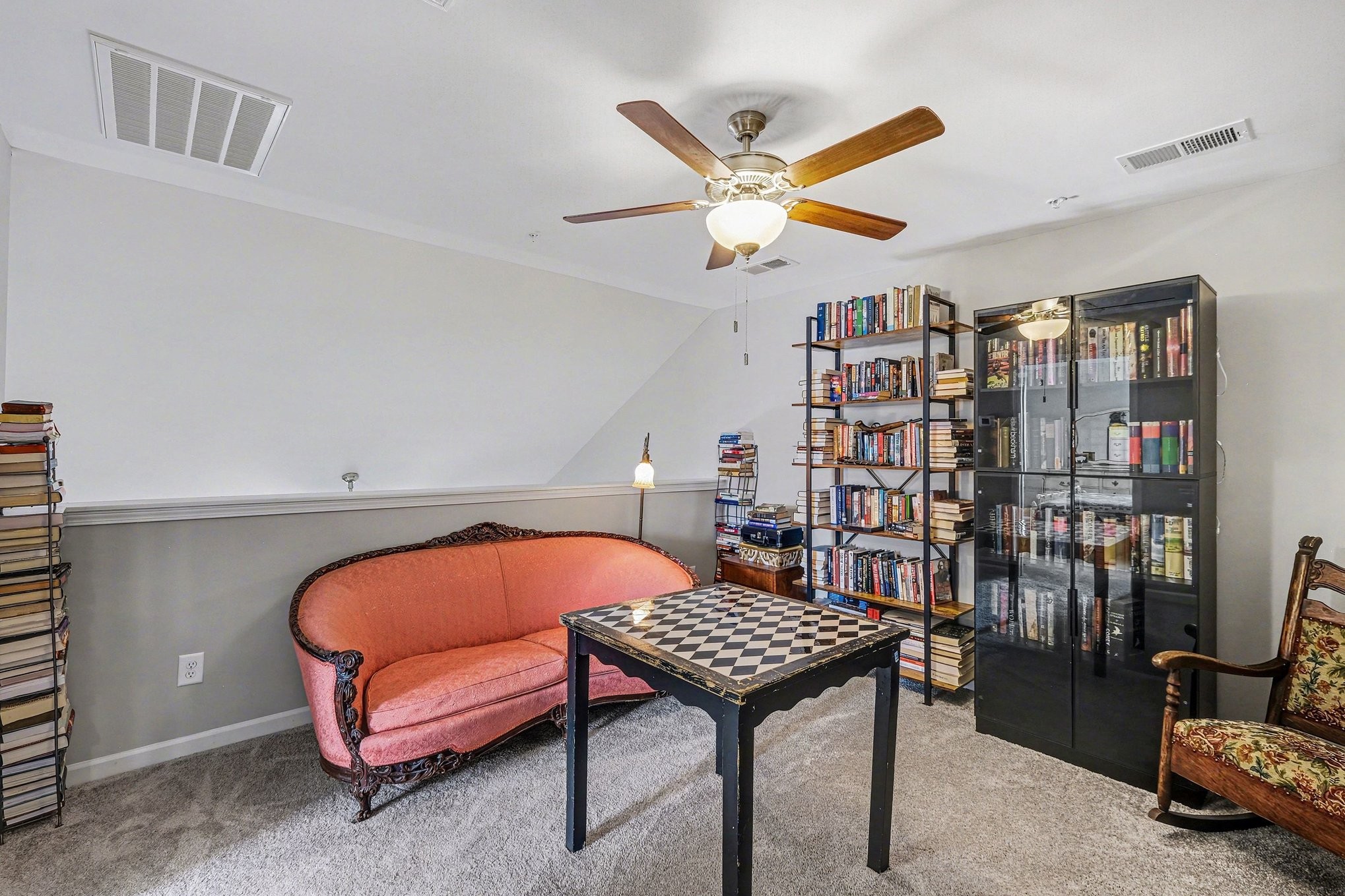 381 Ezra Street Pleasant View, TN 37146 - Photo 21 of 31 a living room with a couch and a book shelf