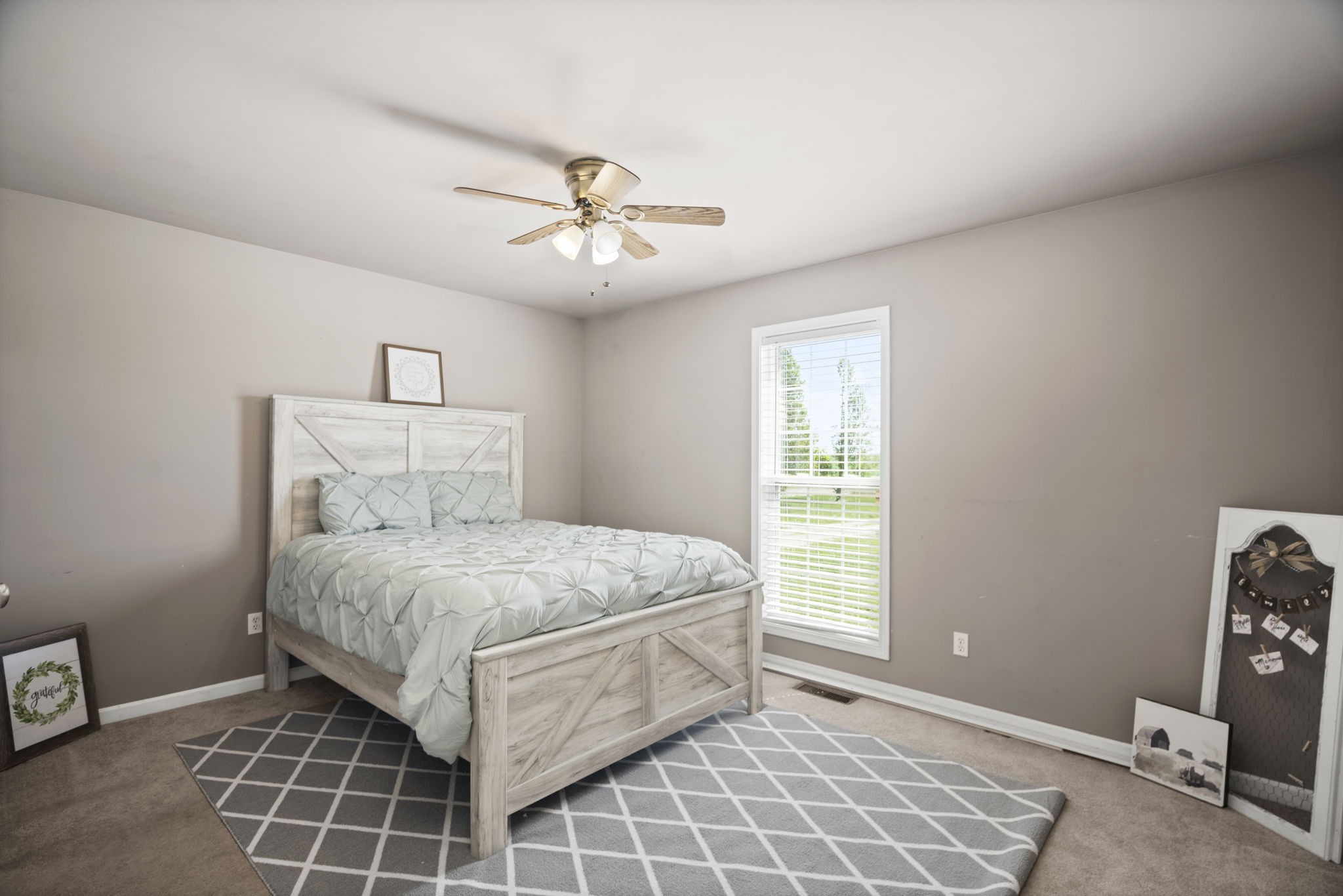 5958 Fred Perry Road Springfield, TN 37172 - Photo 14 of 32 a bedroom with a bed and a window